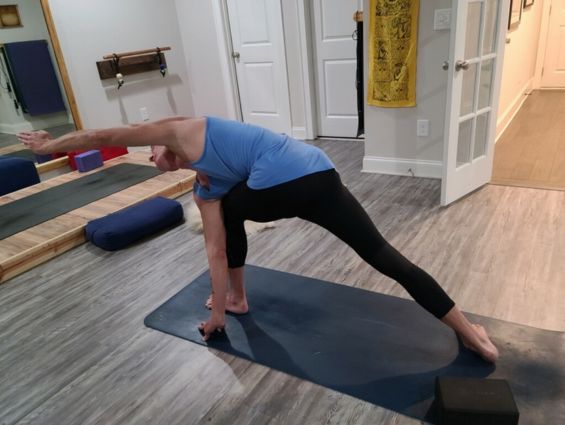 P4 business person doing yoga, maybe with tech in background