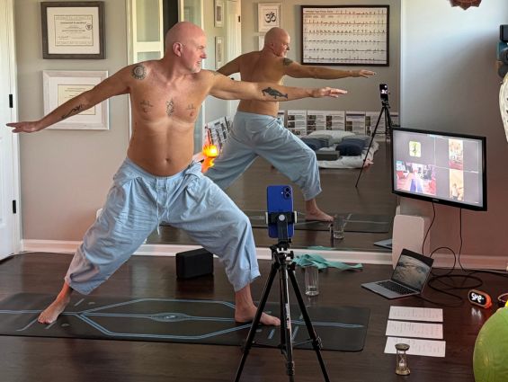 H4 A laptop on a yoga mat, facing away from the camera.